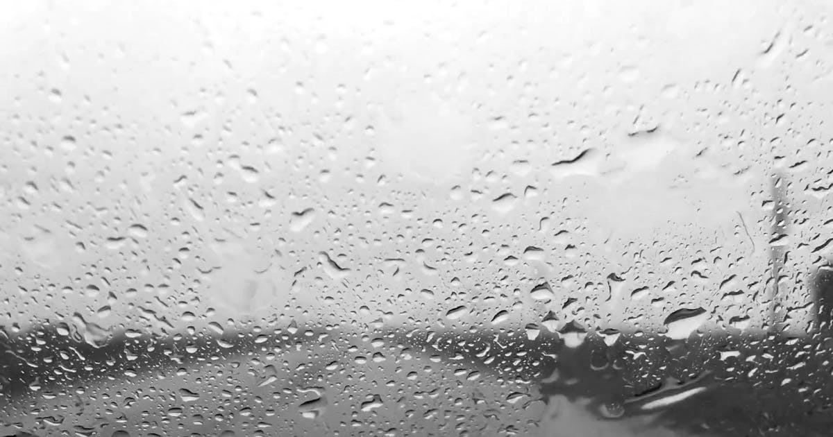 Auto glass windshield with rain droplets